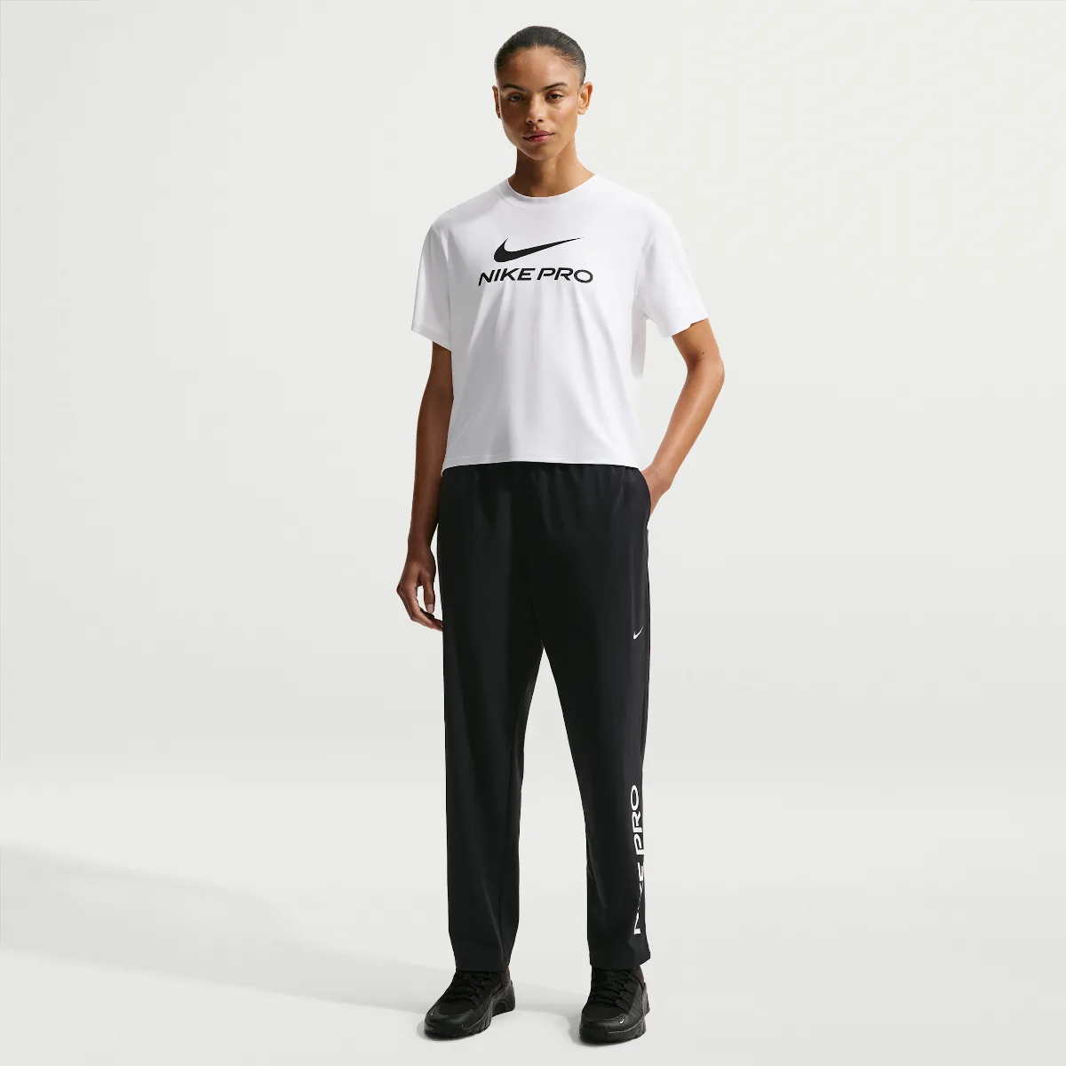 Nike Pro 365 Dri-FIT Mid-Rise Woven Pants by Nike