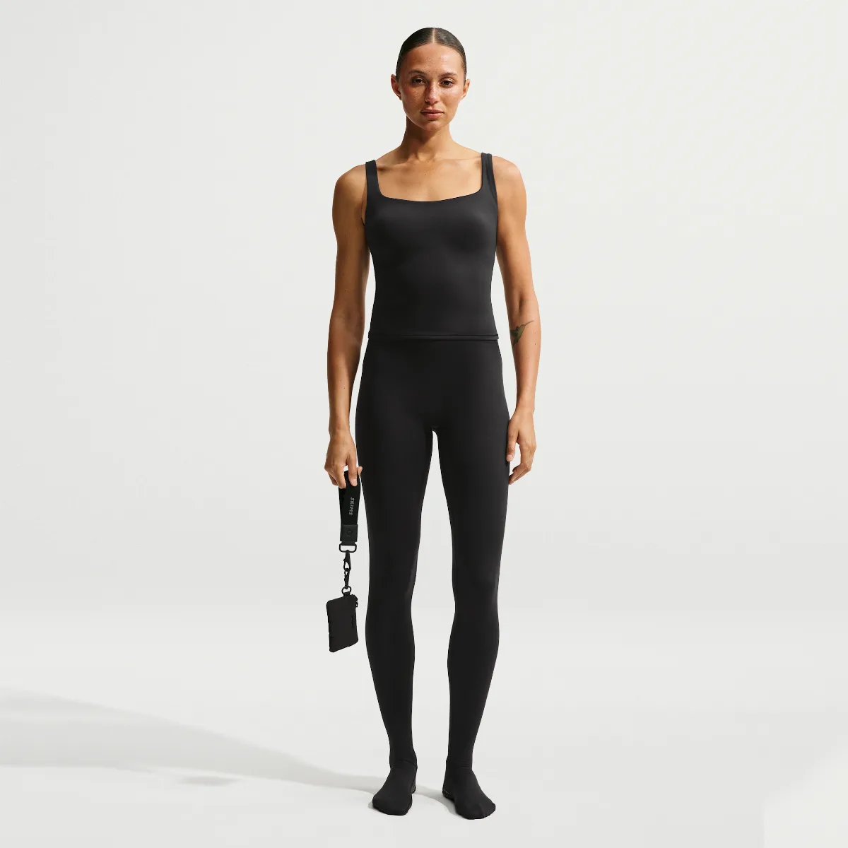 SKIMS Matte High-Waisted Footsie Grip Leggings by Nike