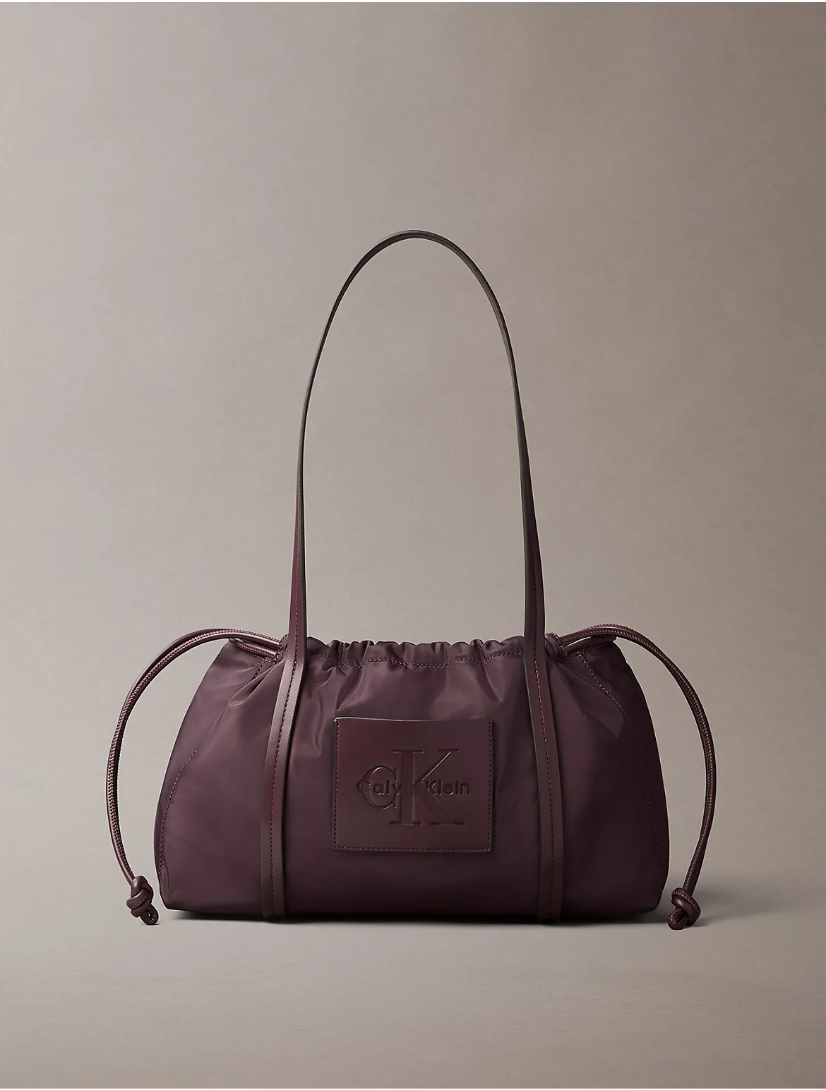 Embossed Monologo Satchel Bag by Calvin Klein