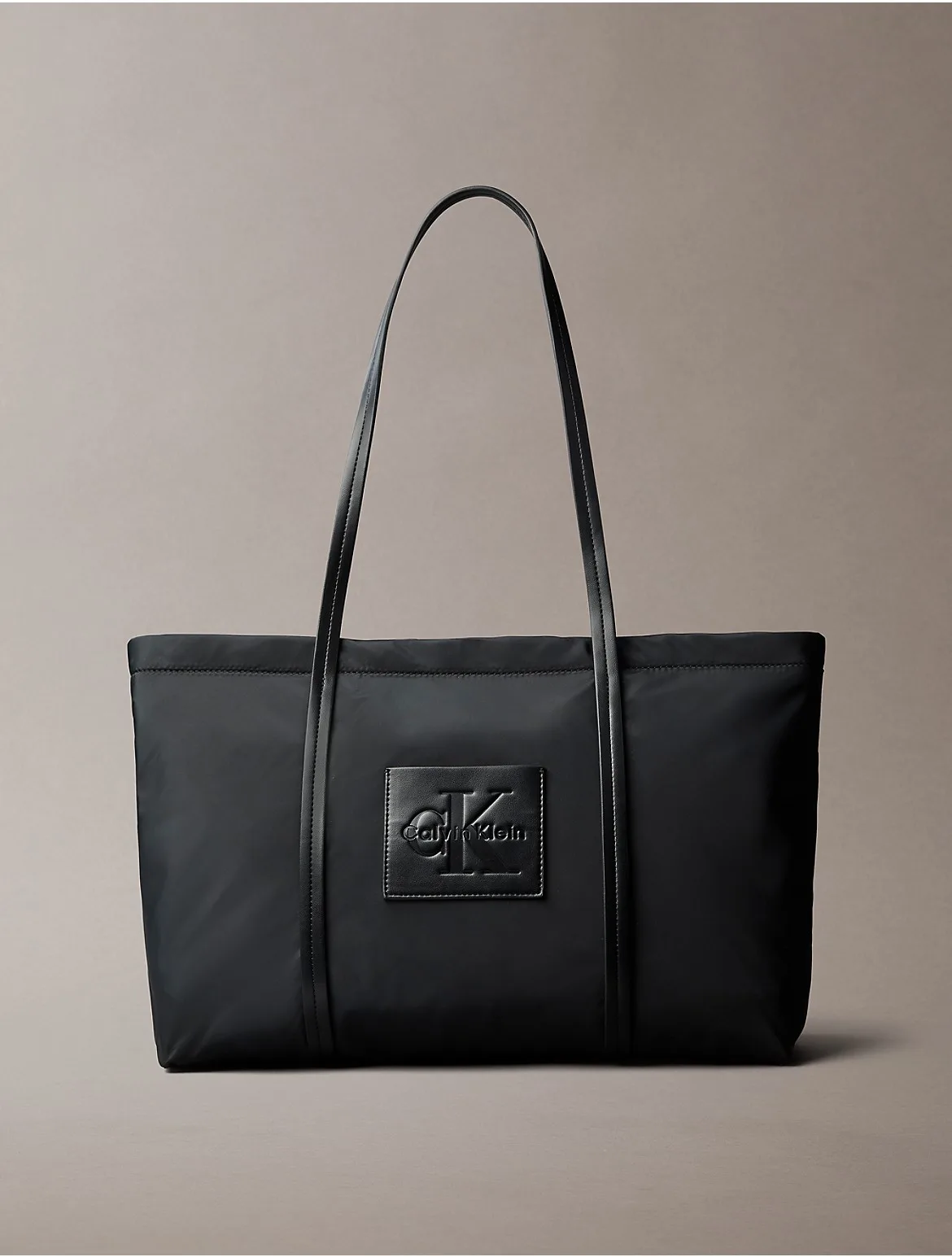 Embossed Monologo Tote Bag by Calvin Klein