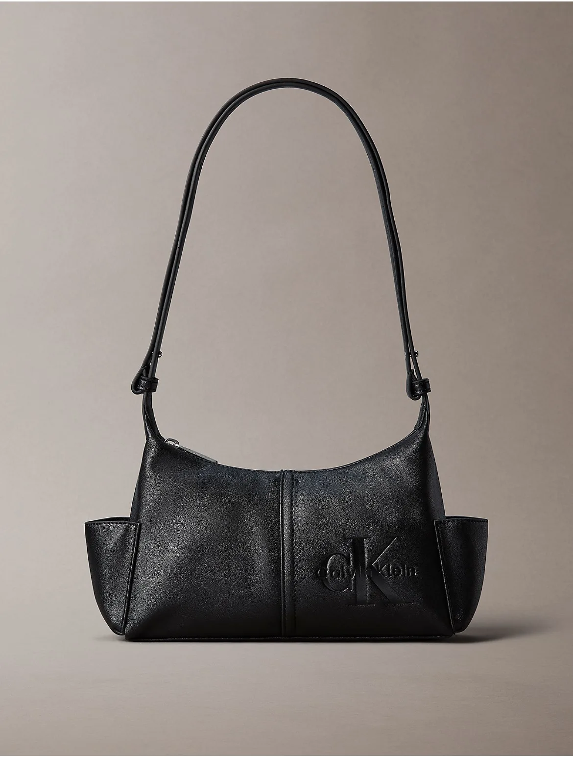 Embossed Monologo Crossbody Bag by Calvin Klein