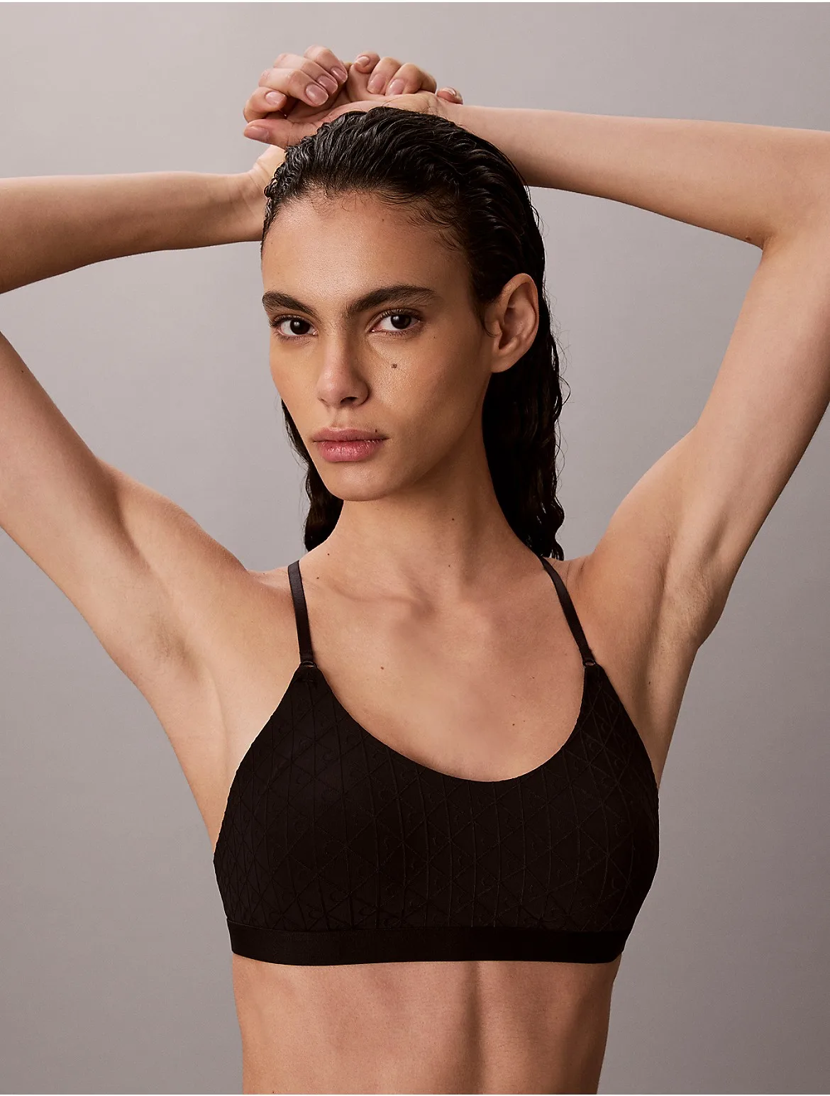 Embossed Emblem Lightly Lined Bralette by Calvin Klein