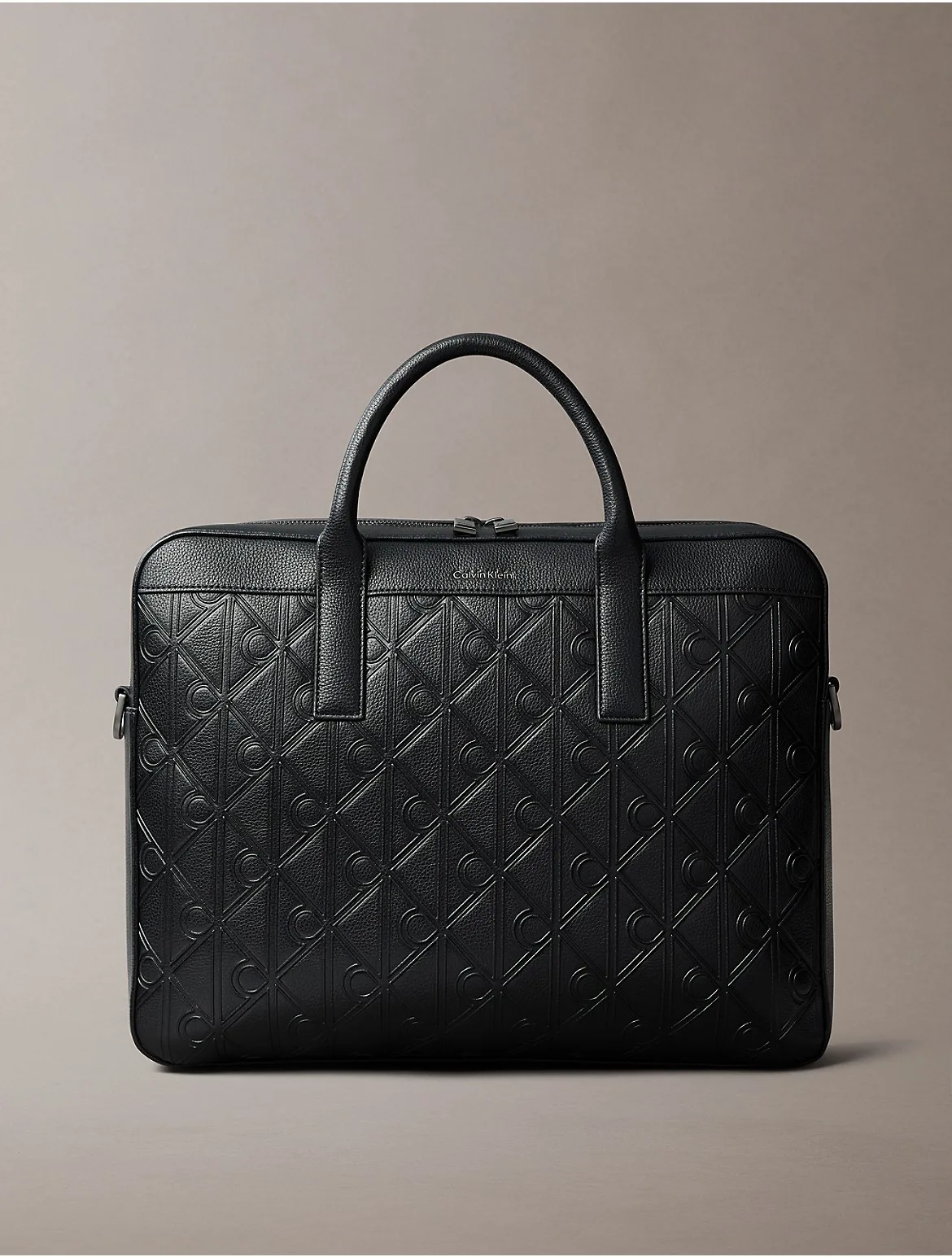 Debossed Allover Emblem Logo Commuter Bag by Calvin Klein