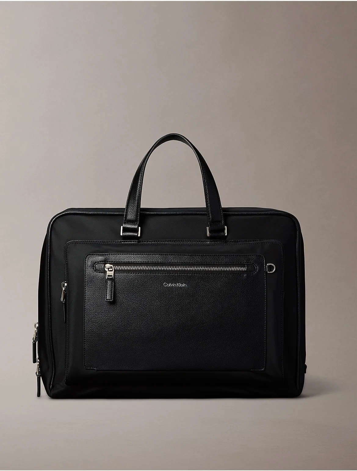 Raised Logo Slim Commuter Bag by Calvin Klein
