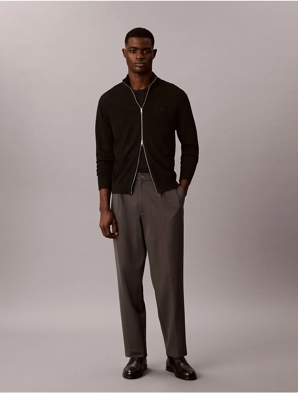 Tech Knit Tapered Pleated Pants by Calvin Klein