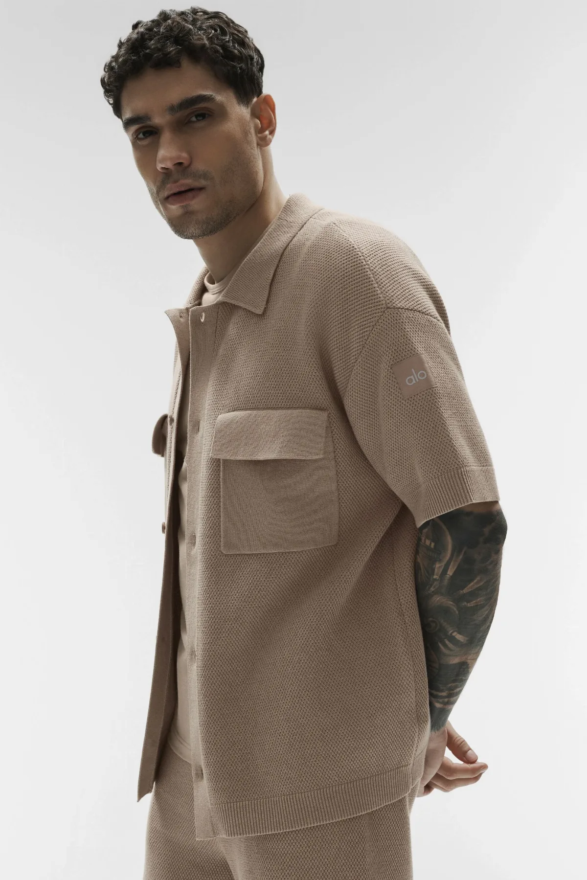 Sports Club Sweater Knit Short Sleeve Button Up Top by ALO