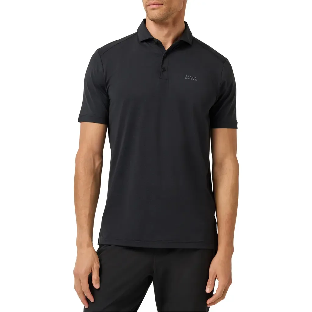 The Heater Solid Short Sleeve Performance Polo by TravisMathew