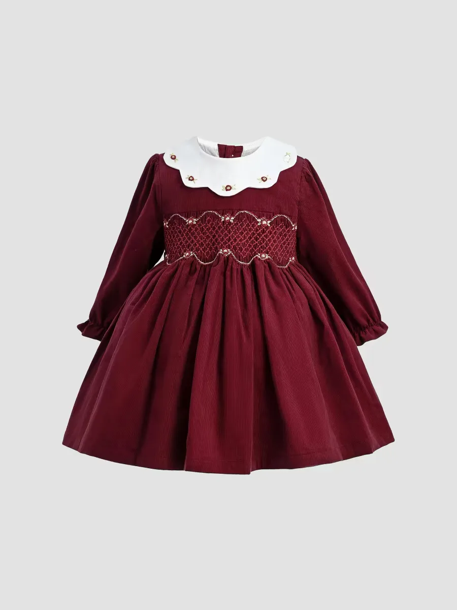 Smocked Holiday Dress by Tulleen