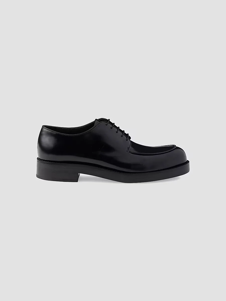 Brushed Leather Derby Shoes by Prada