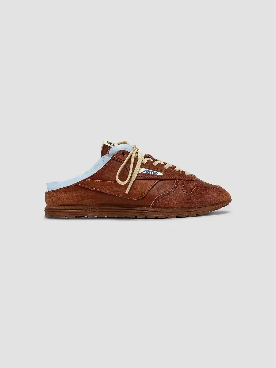 The Windspin Raw-Edge Leather Sneaker Mules by AUTRY