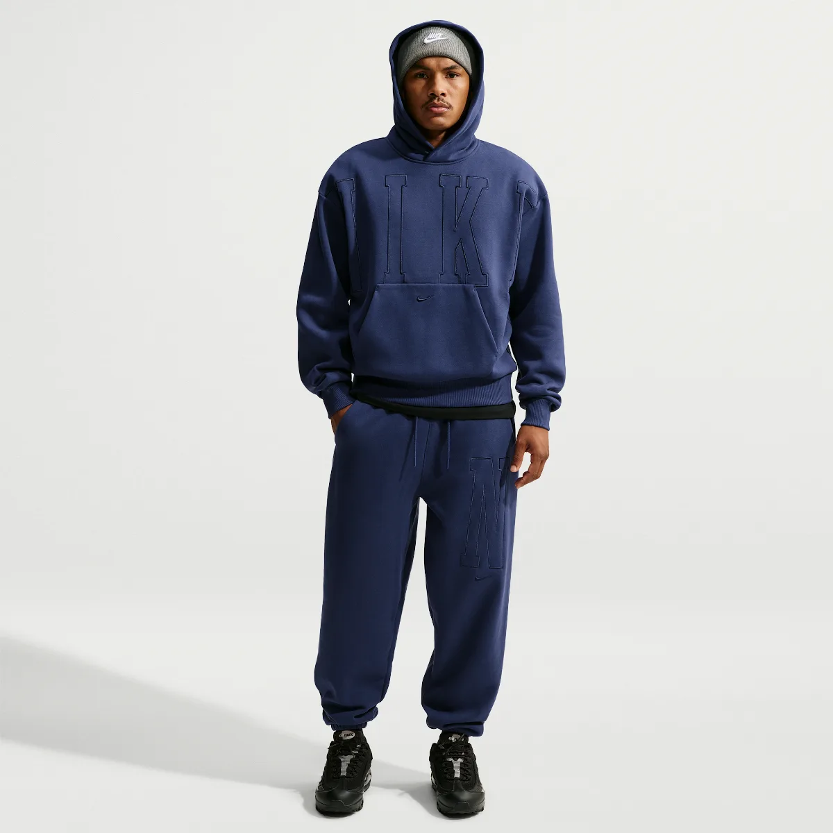 Solo Fleece Loose Cuffed Pants by Nike