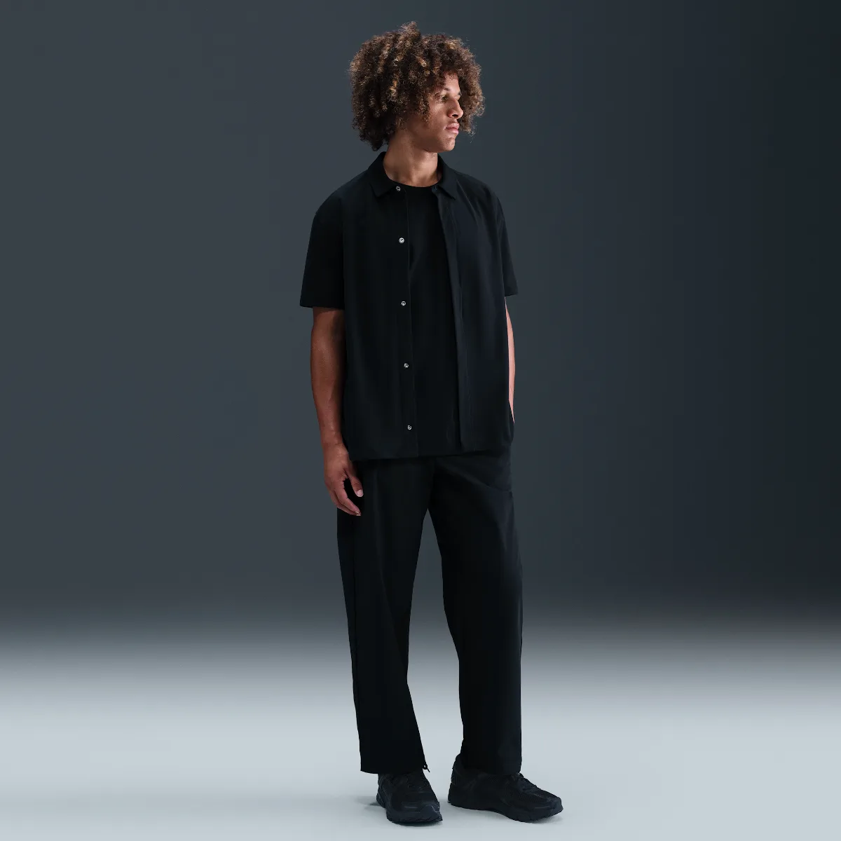 24.7 PerfectStretch Dri-FIT Loose-Fit Chino Trousers by Nike