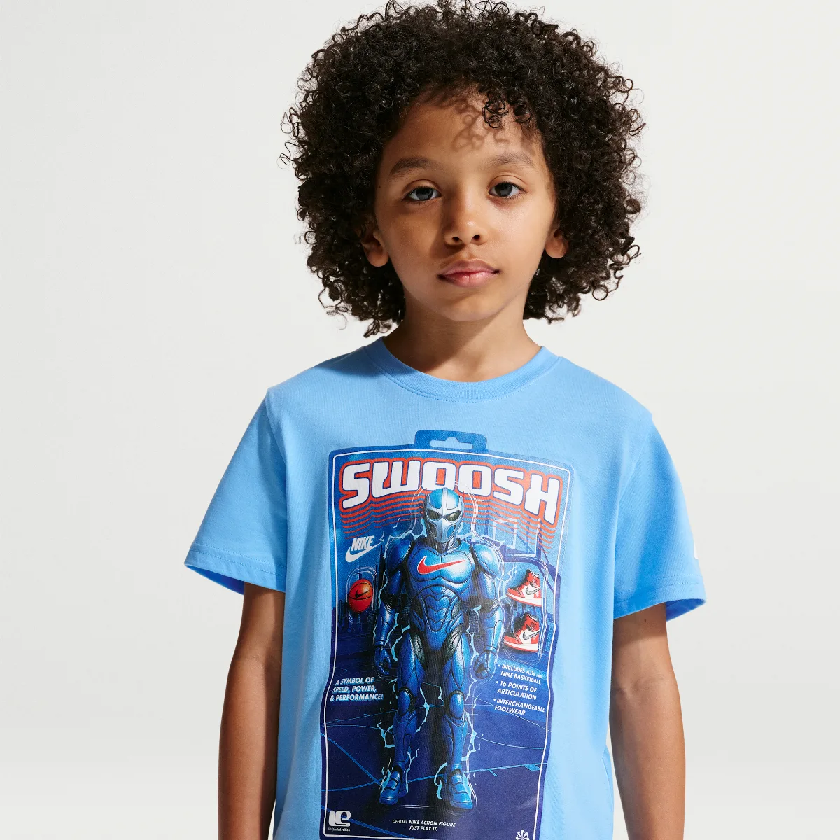 Swoosh Action Figure T-Shirt by Nike