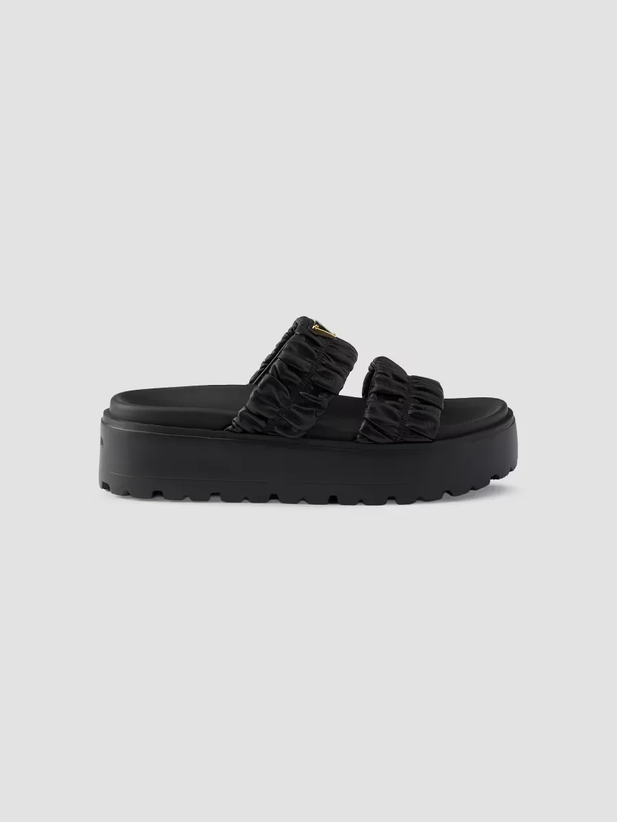 Matelass Nappa Leather Flatform Slides by Prada