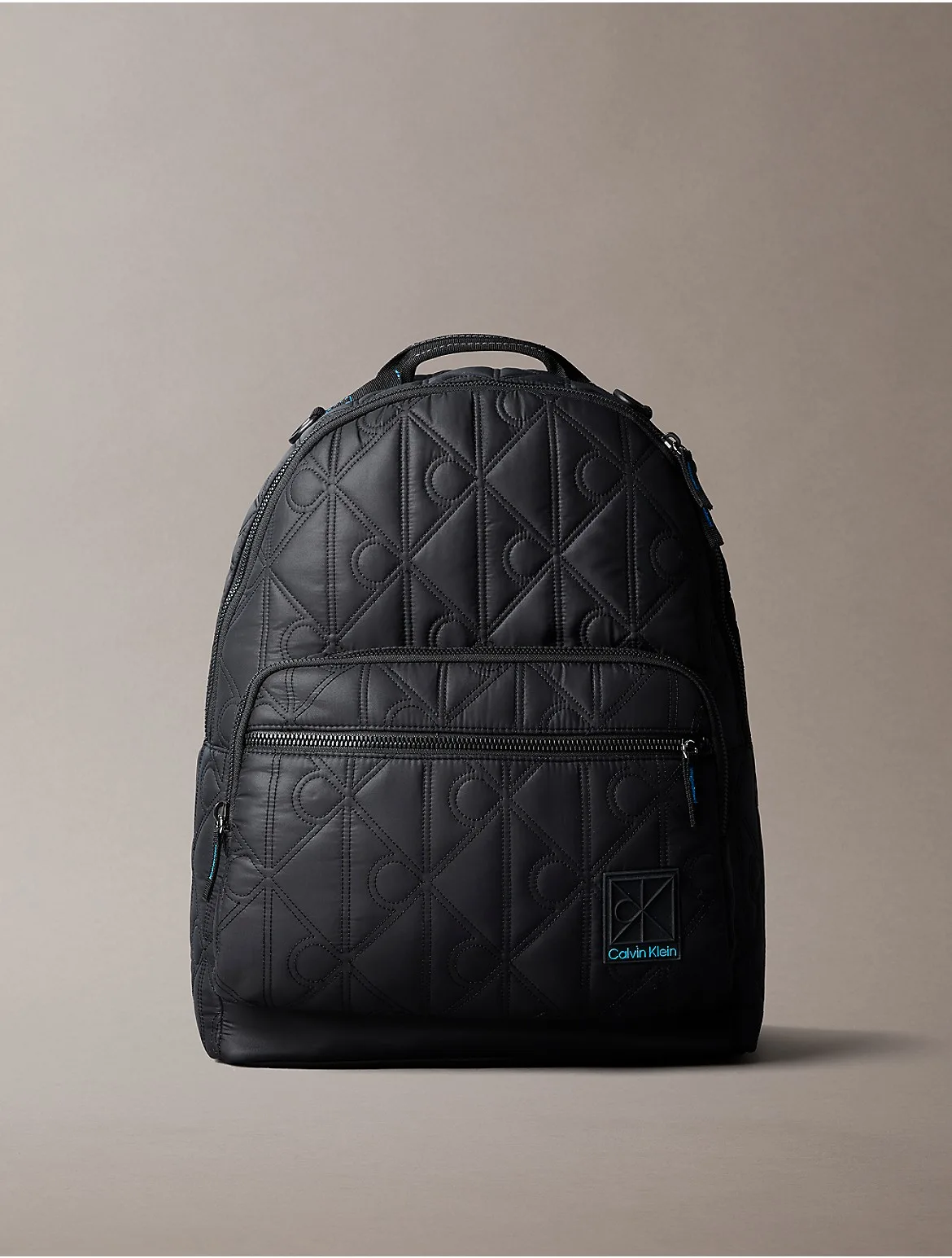 Emblem Logo Puffer Backpack by Calvin Klein
