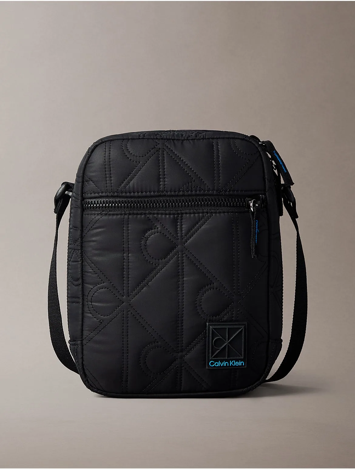 Emblem Logo Puffer Reporter Bag by Calvin Klein