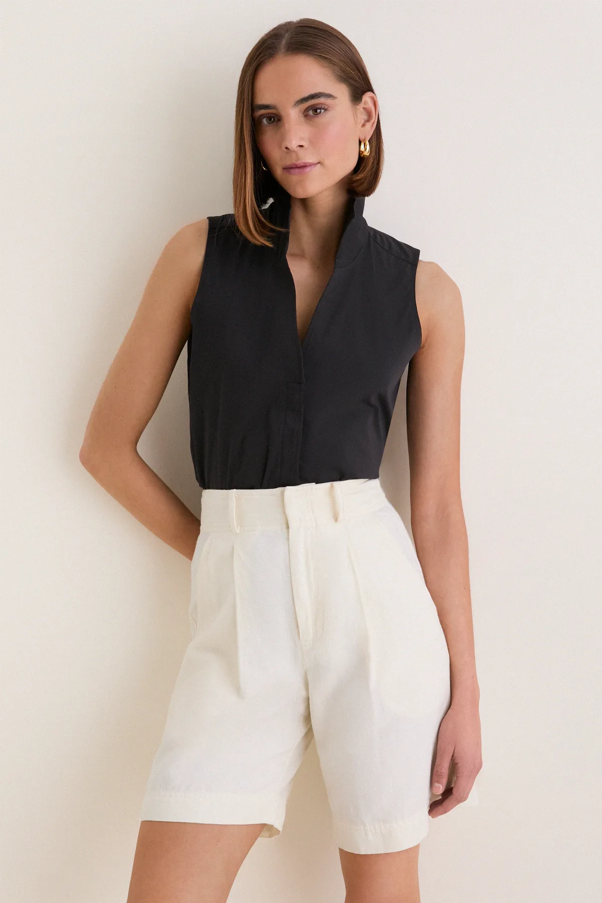 Black Sleeveless Bessette Button Down by Tuckernuck