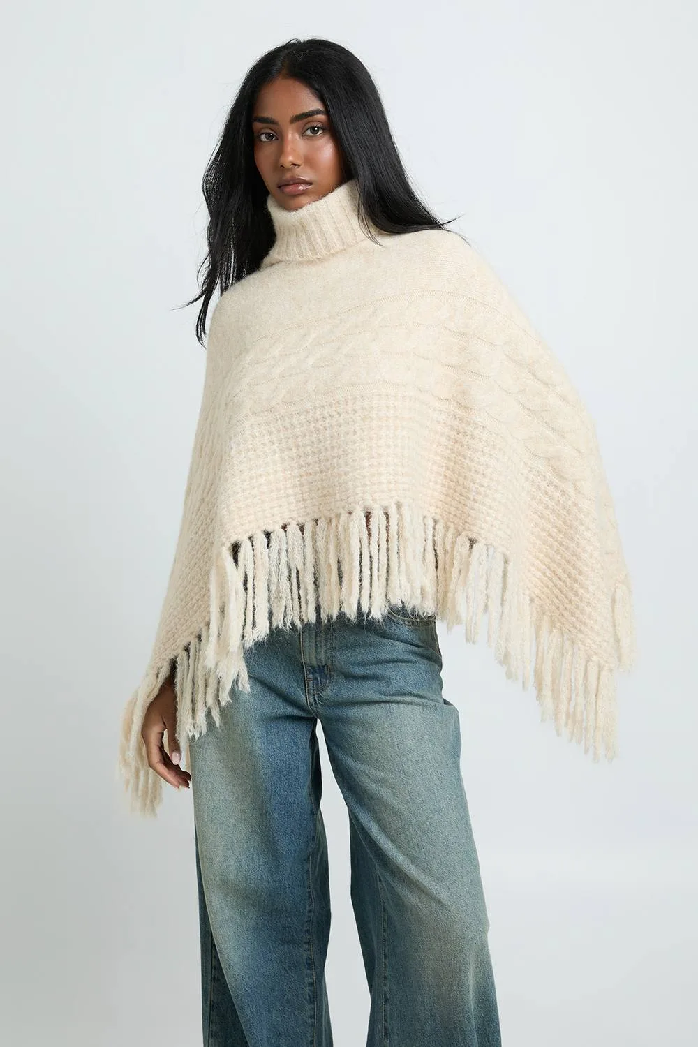 Roll Neck Cable Detail Tassel Hem Cape by boohoo