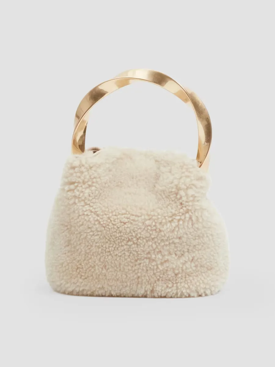 Nixi Mini Shearling Twist Bucket Bag by SIMKHAI