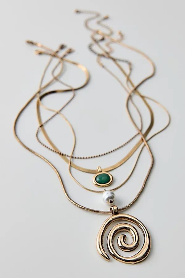 Saturn Swirl Layering Necklace Set by Urban Outfitters