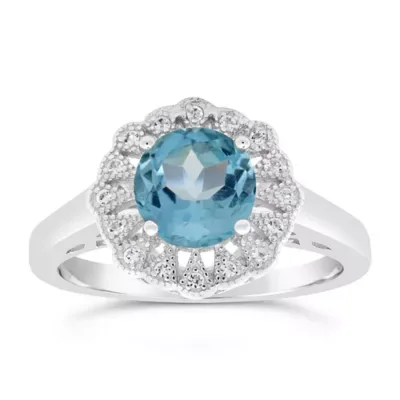 Round Blue Topaz Halo Birthstone Ring in Sterling Silver by Gemminded