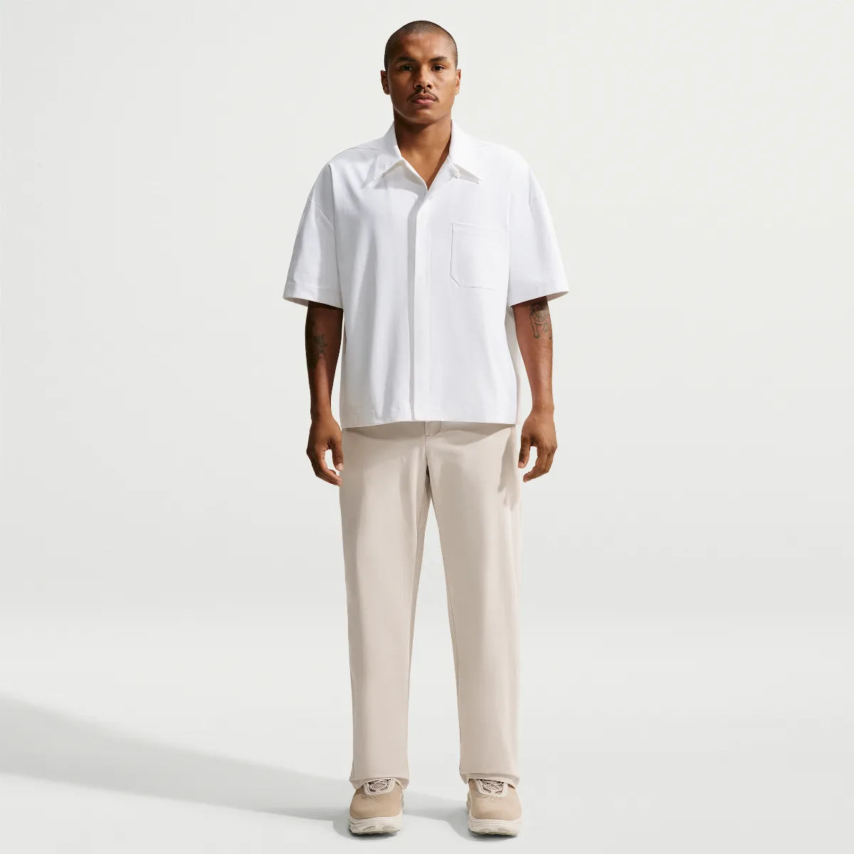 24.7 PerfectStretch Dri-FIT Loose-Fit Chino Trousers by Nike