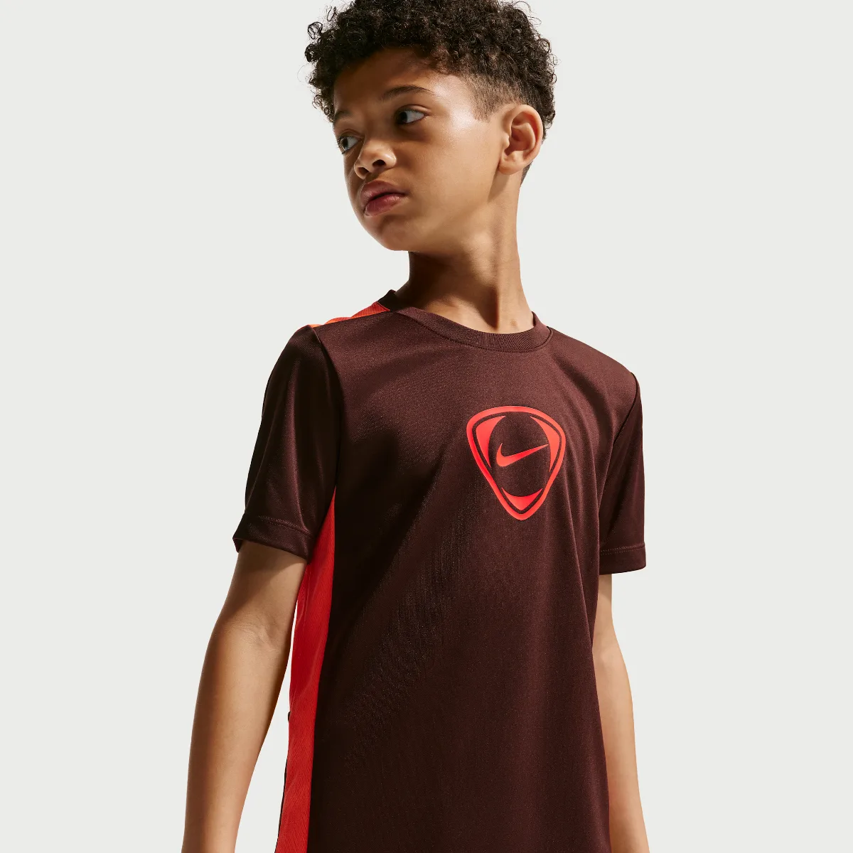 Academy+ Big Kids Dri-FIT Short-Sleeve Soccer Top by Nike